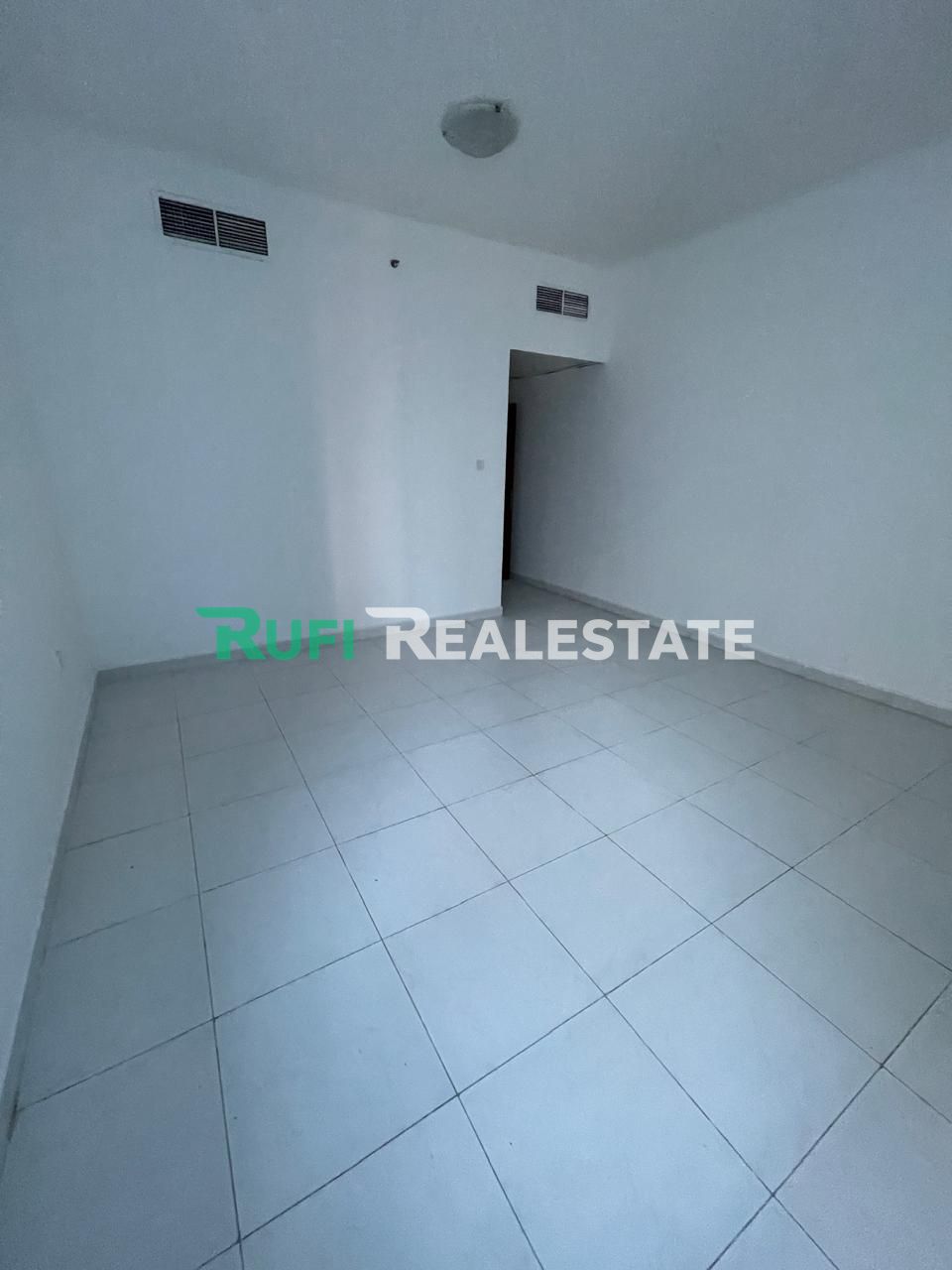 A room and a living room in Falcon Towers with a distinctive area and an excellent location in the heart of Ajman, plus a beautiful view